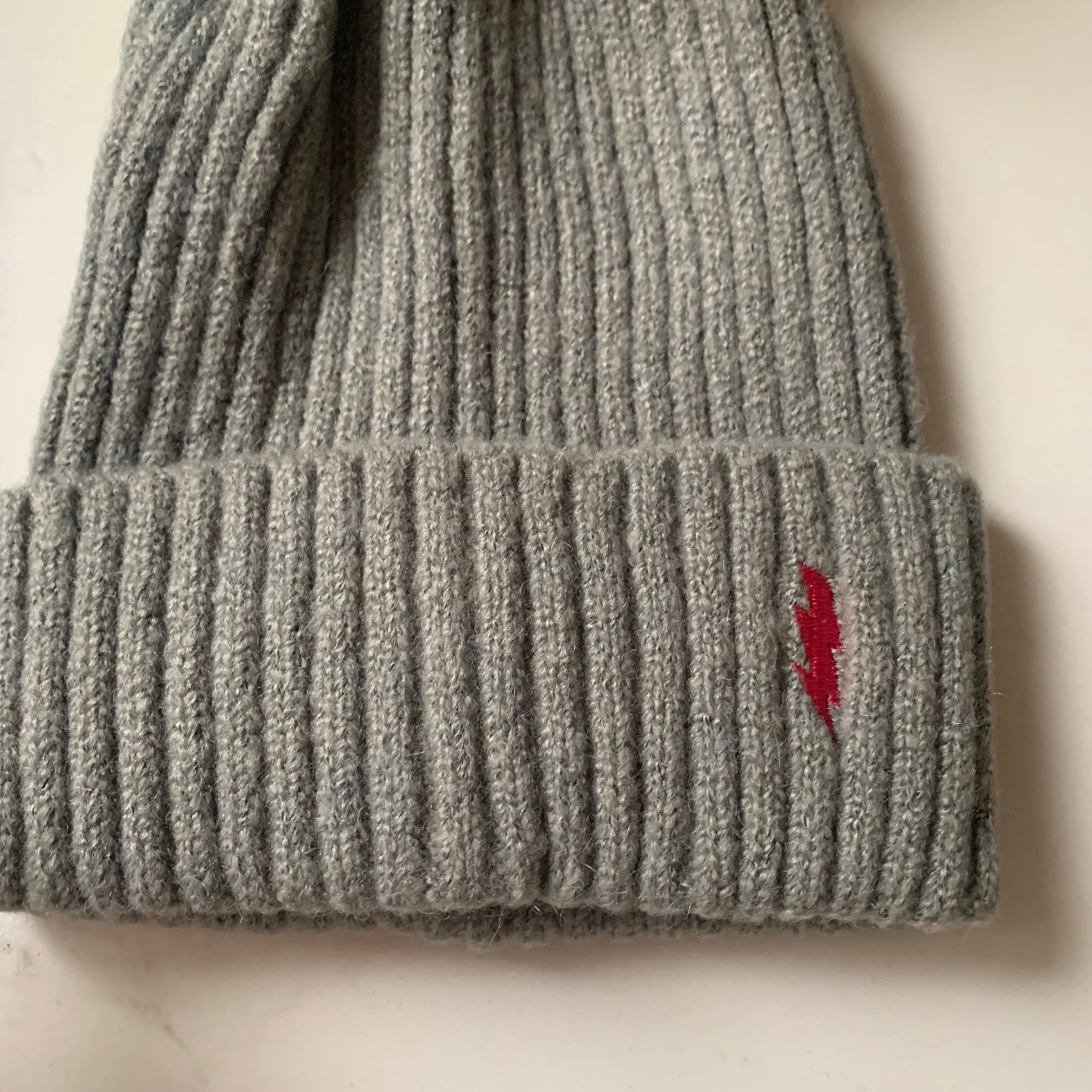 Soft pom pom hats - embroidered lightning bolt
