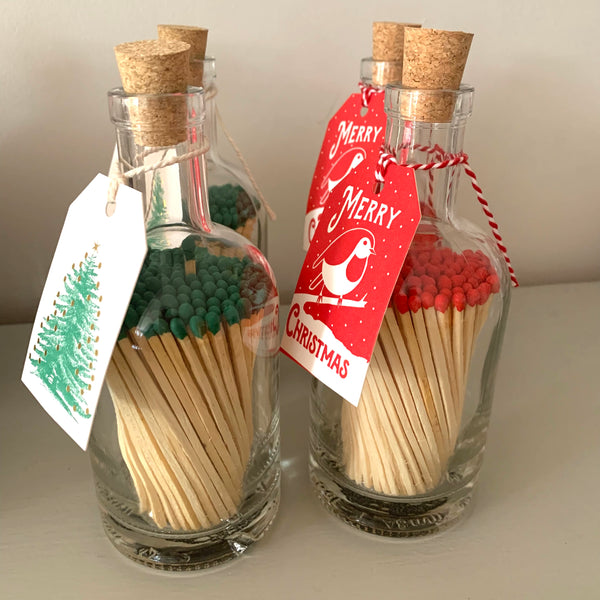 Coloured long matches in glass bottle