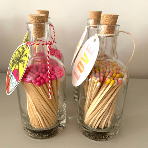 Coloured long matches in glass bottle